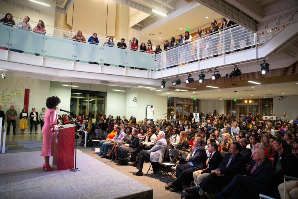 Chimamanda Ngozi Adichie addressing a crowd 